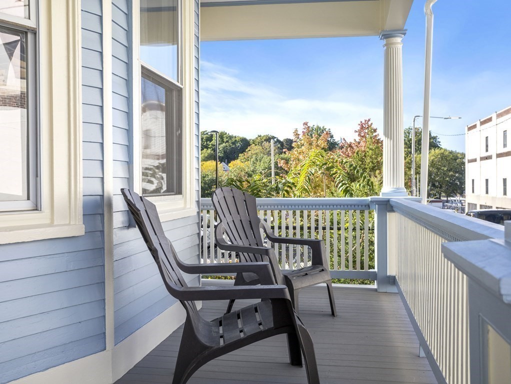 8 Marbury Terrace, Unit 1 Boston, MA 02130 - Photo 24 of 35 a view of a balcony with chair and table