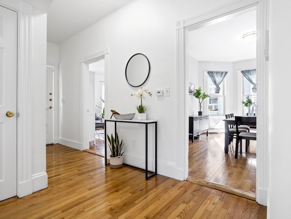 8 Marbury Terrace, Unit 1 Boston, MA 02130 - Photo 4 of 35 a view of a dining room with furniture window and wooden floor