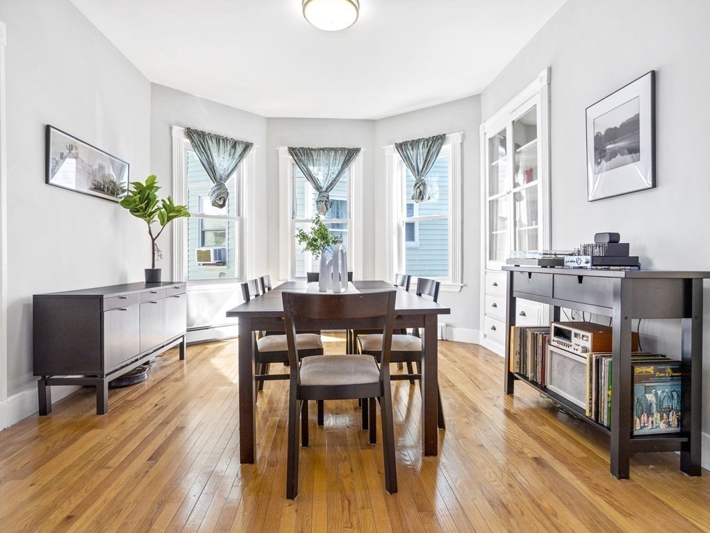 8 Marbury Terrace, Unit 1 Boston, MA 02130 - Photo 5 of 35 a view of a dining room with furniture window and wooden floor
