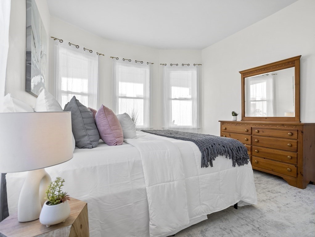 8 Marbury Terrace, Unit 1 Boston, MA 02130 - Photo 10 of 35 a bedroom with a bed and window