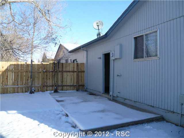 1875 Monterey Road Colorado Springs, CO 80910 - Photo 14 of 15 Fully fenced back yard with patio.