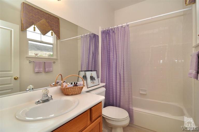 394 Woodland Road Simi Valley, CA 93065 - Photo 23 of 26 a bathroom with a sink toilet and shower