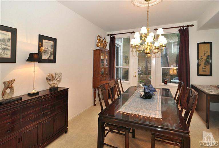394 Woodland Road Simi Valley, CA 93065 - Photo 7 of 26 a view of a dining room with furniture and chandelier