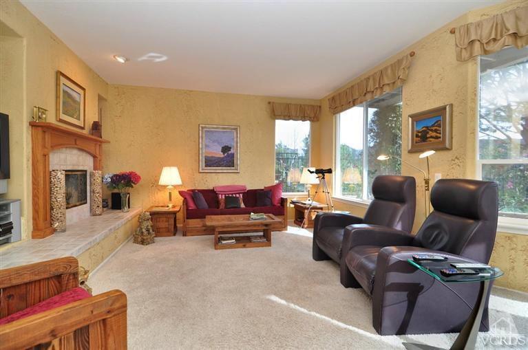394 Woodland Road Simi Valley, CA 93065 - Photo 9 of 26 a living room with furniture or couch and a fireplace