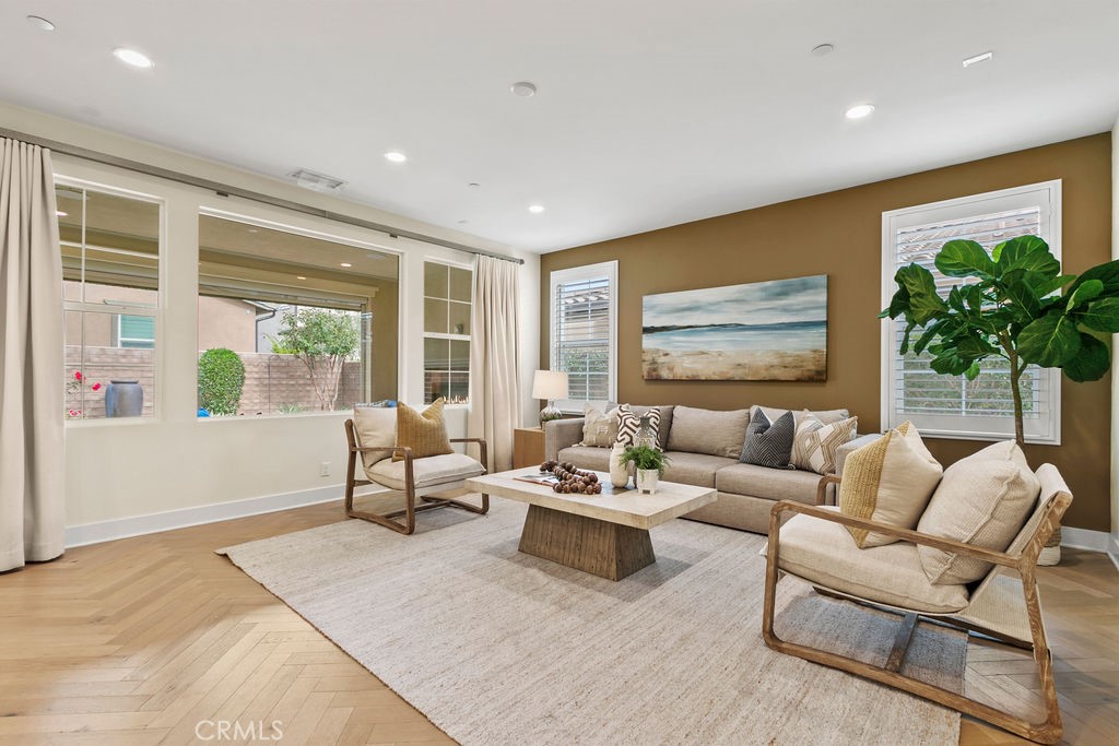 8 Platal Street Rancho Mission Viejo, CA 92694 - Photo 12 of 40 a living room with furniture and a large window