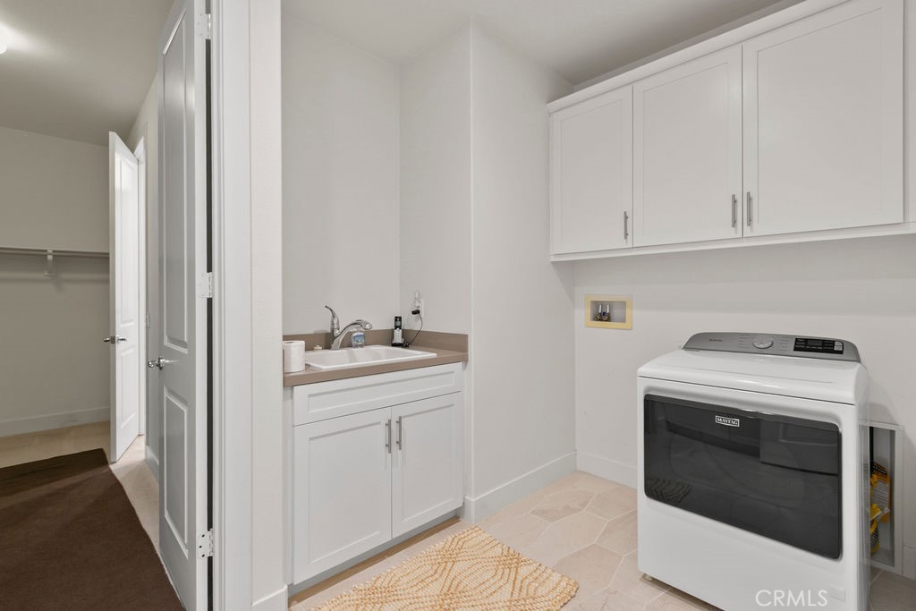 8 Platal Street Rancho Mission Viejo, CA 92694 - Photo 18 of 40 a utility room with dryer and washer