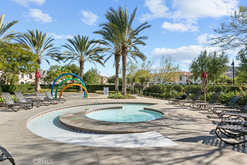 8 Platal Street Rancho Mission Viejo, CA 92694 - Photo 35 of 40 a view of a swimming pool with a house