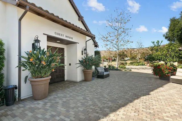 a view of a porch with potted plants