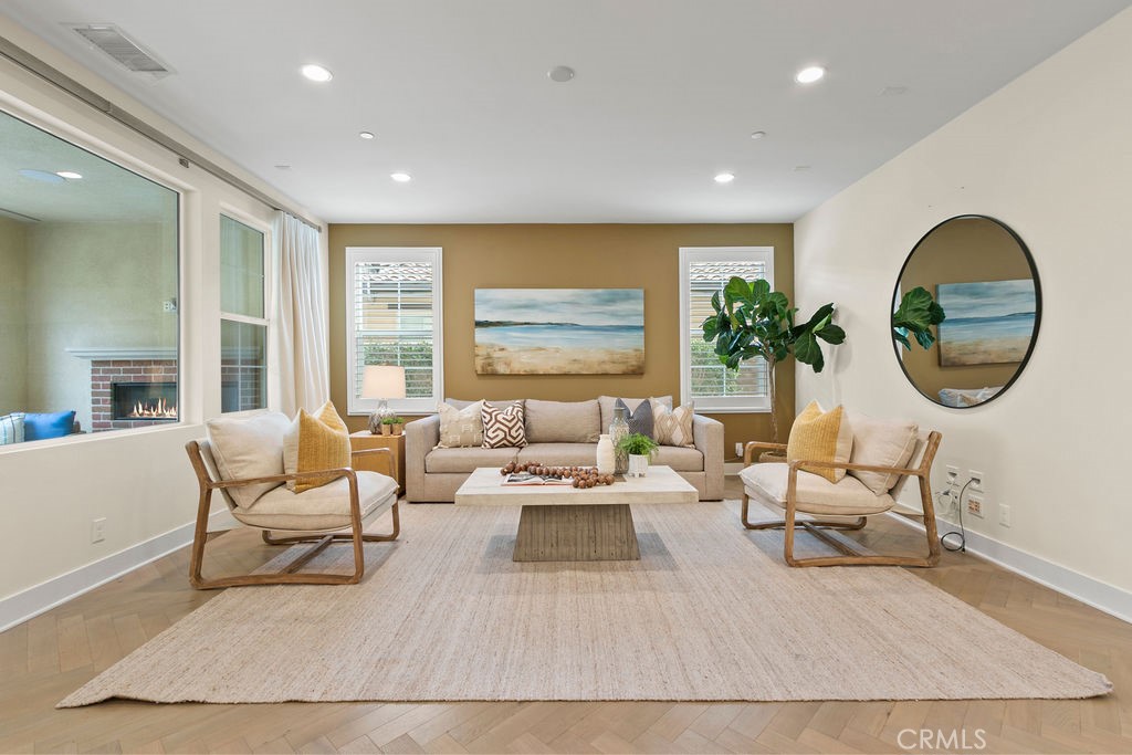 8 Platal Street Rancho Mission Viejo, CA 92694 - Photo 4 of 40 a living room with furniture and a large window