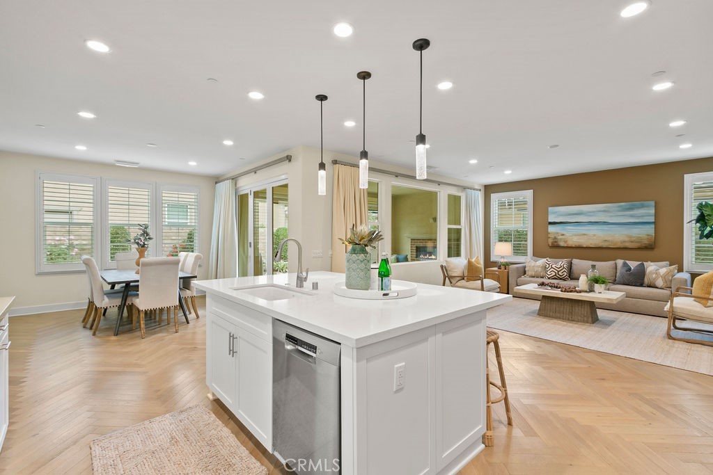 8 Platal Street Rancho Mission Viejo, CA 92694 - Photo 9 of 40 a large kitchen with kitchen island a large window in it