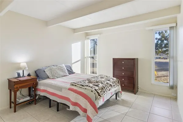 a bedroom with a bed and cabinets