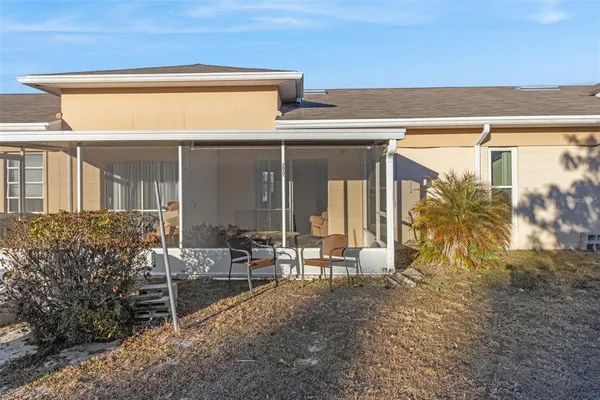 a view of house with patio outdoor seating area