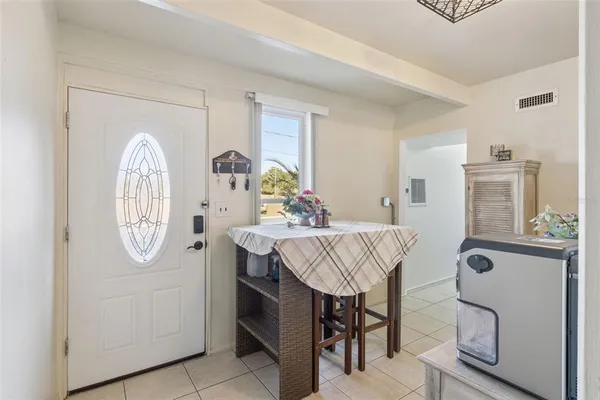 a view of kitchen with furniture and wooden floor
