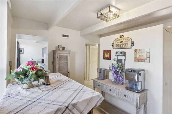 a bedroom with a bed and a table in it