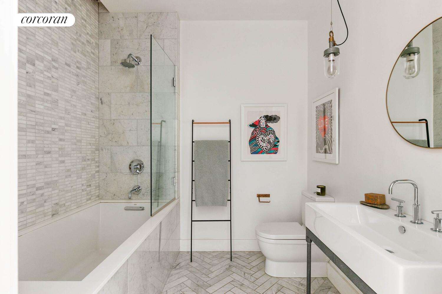 85 North 3rd Street, Unit 309 Brooklyn, NY 11249 - Photo 14 of 16 a bathroom with a sink toilet and shower