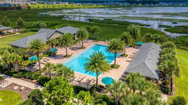 a view of a swimming pool with an outdoor seating
