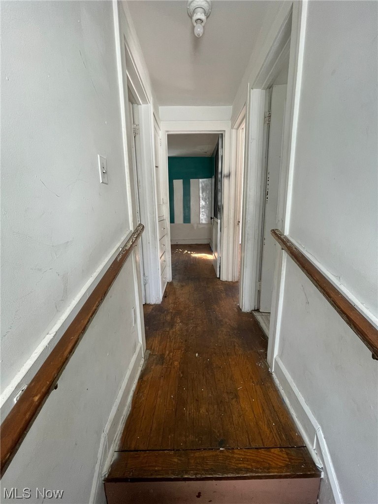1493 Larchmont Road Cleveland, OH 44110 - Photo 12 of 30 Corridor featuring dark hardwood flooring