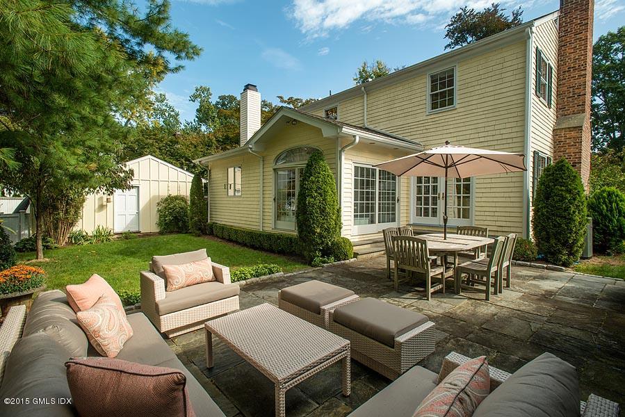 24 Meadow Road Riverside, CT 06878 - Photo 16 of 16 a view of a house with couches chairs and a yard
