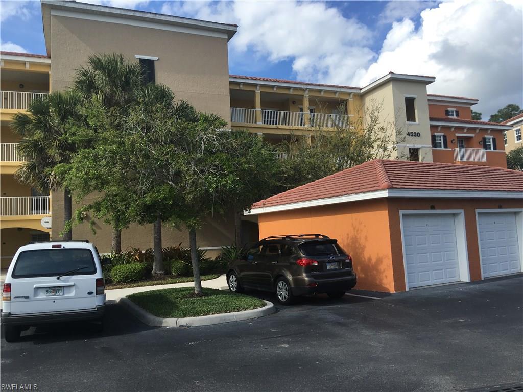 4530 Botanical Pl Circle, Unit 206 Naples, FL 34112 - Photo 20 of 25 a view of a car parked in front of a house