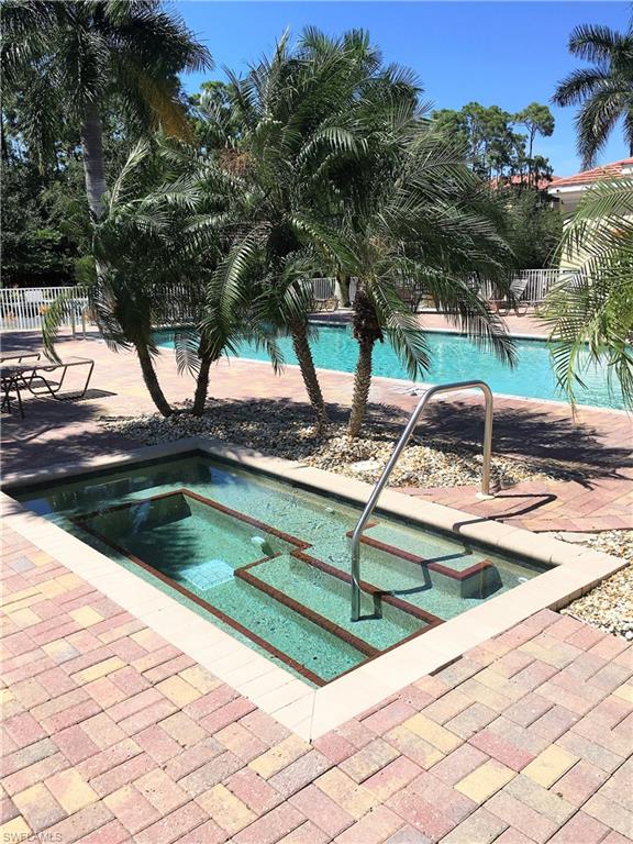 4530 Botanical Pl Circle, Unit 206 Naples, FL 34112 - Photo 25 of 25 a view of swimming pool with a yard
