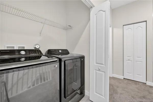 a view of a utility room with racks on the wall