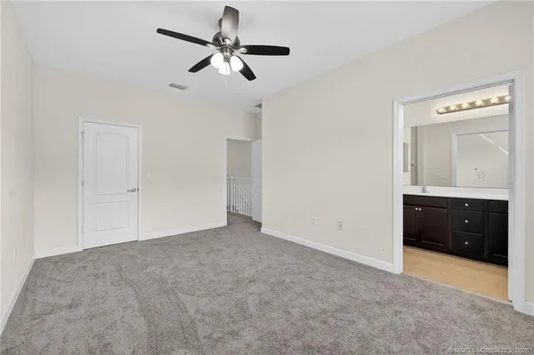 an empty room with closet area