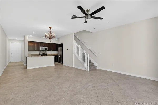 a view of a livingroom with a kitchen