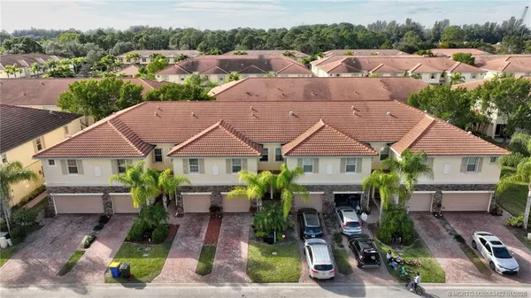 an aerial view of a house with swimming pool lake view and mountain view