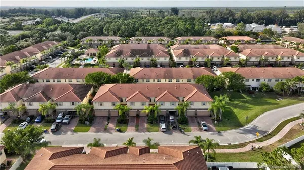 an aerial view of residential houses with outdoor space