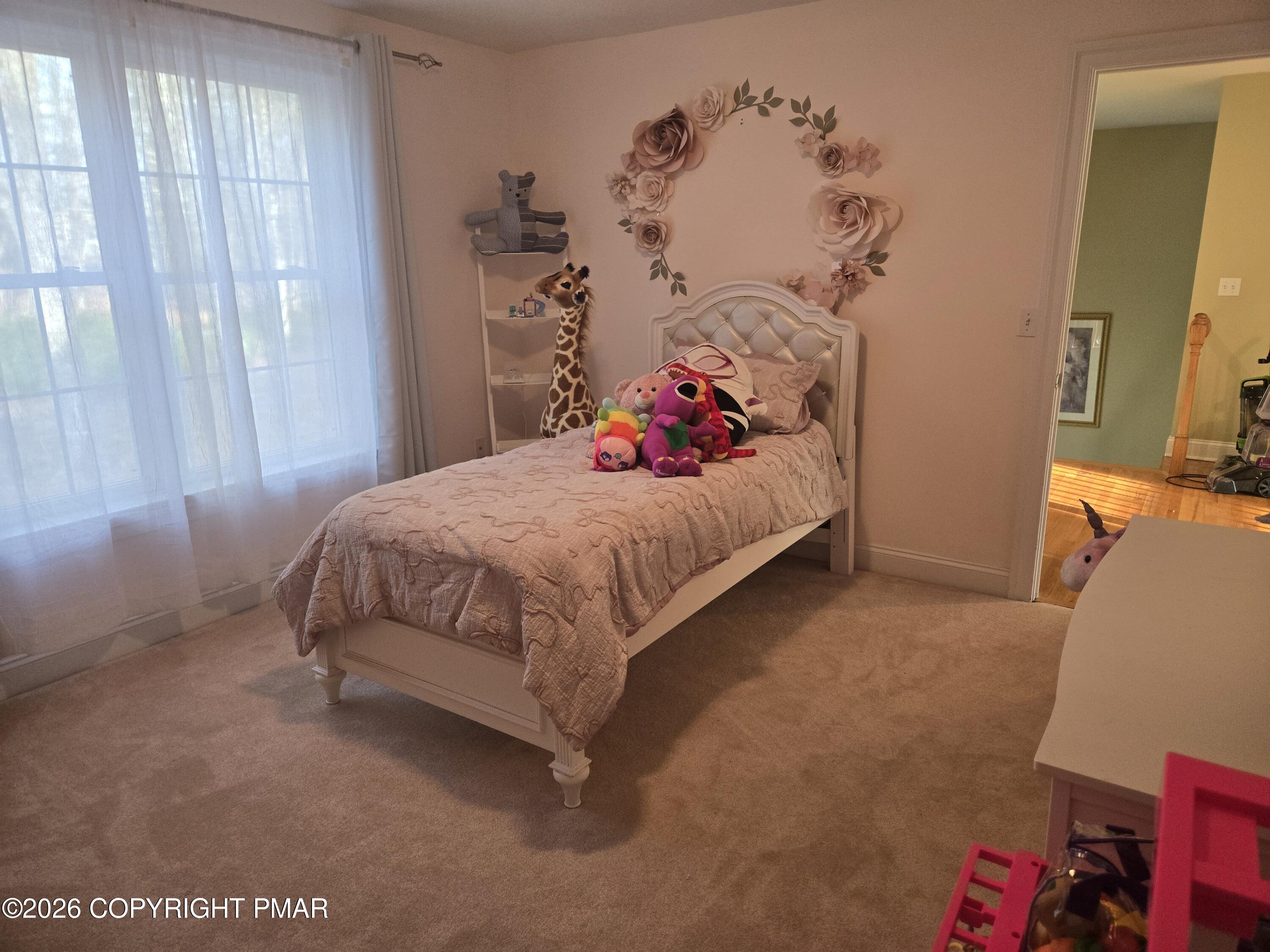 110 Crocus Lane Milford, PA 18337 - Photo 18 of 35 a bedroom with a bed and a window