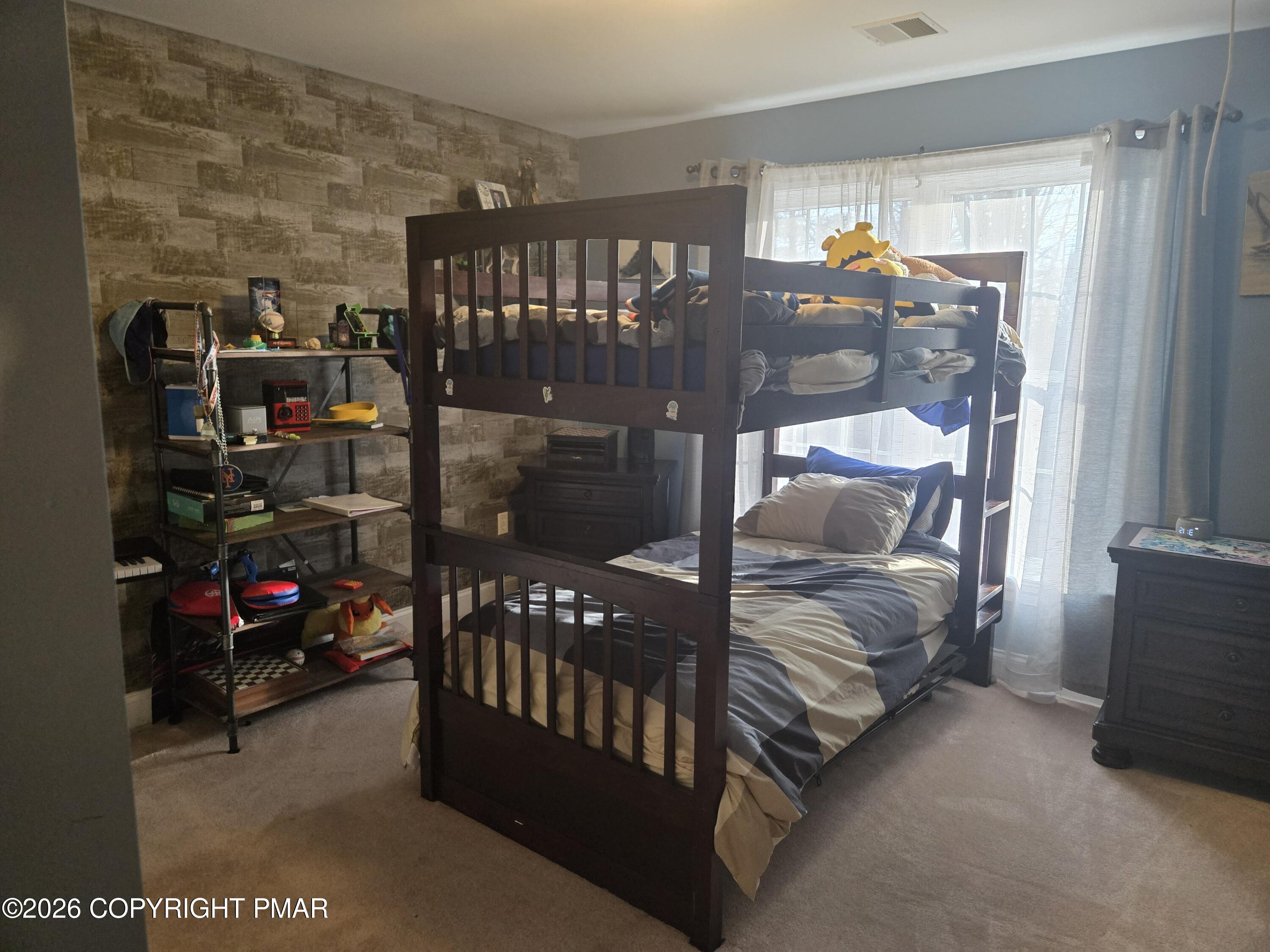110 Crocus Lane Milford, PA 18337 - Photo 19 of 35 a bedroom with two bunk beds and a baby crib