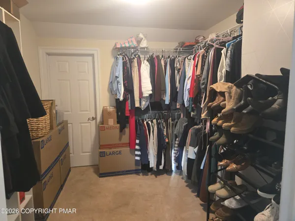 a bedroom with furniture and a bed