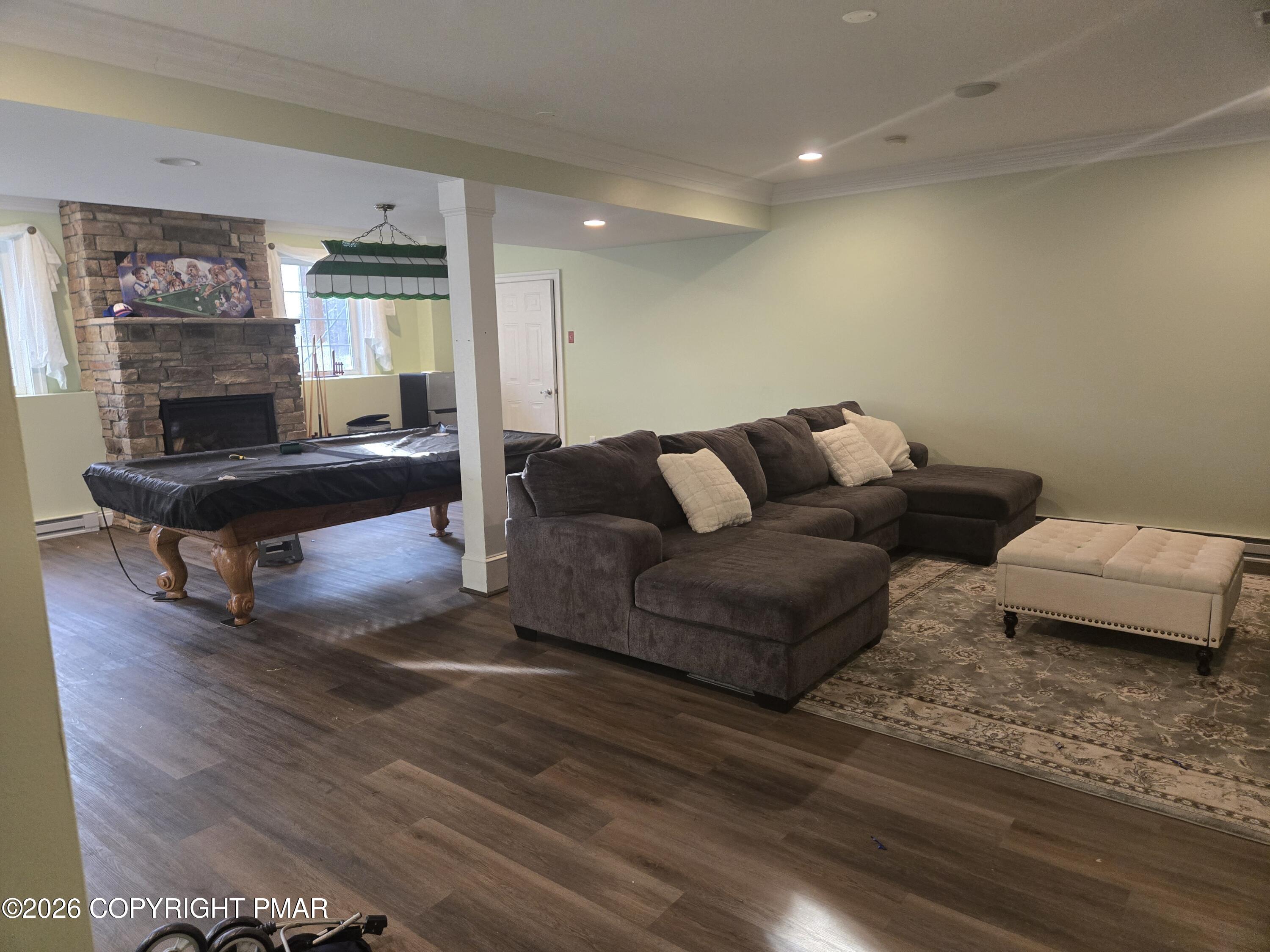 110 Crocus Lane Milford, PA 18337 - Photo 29 of 35 a living room with furniture and a wooden floor