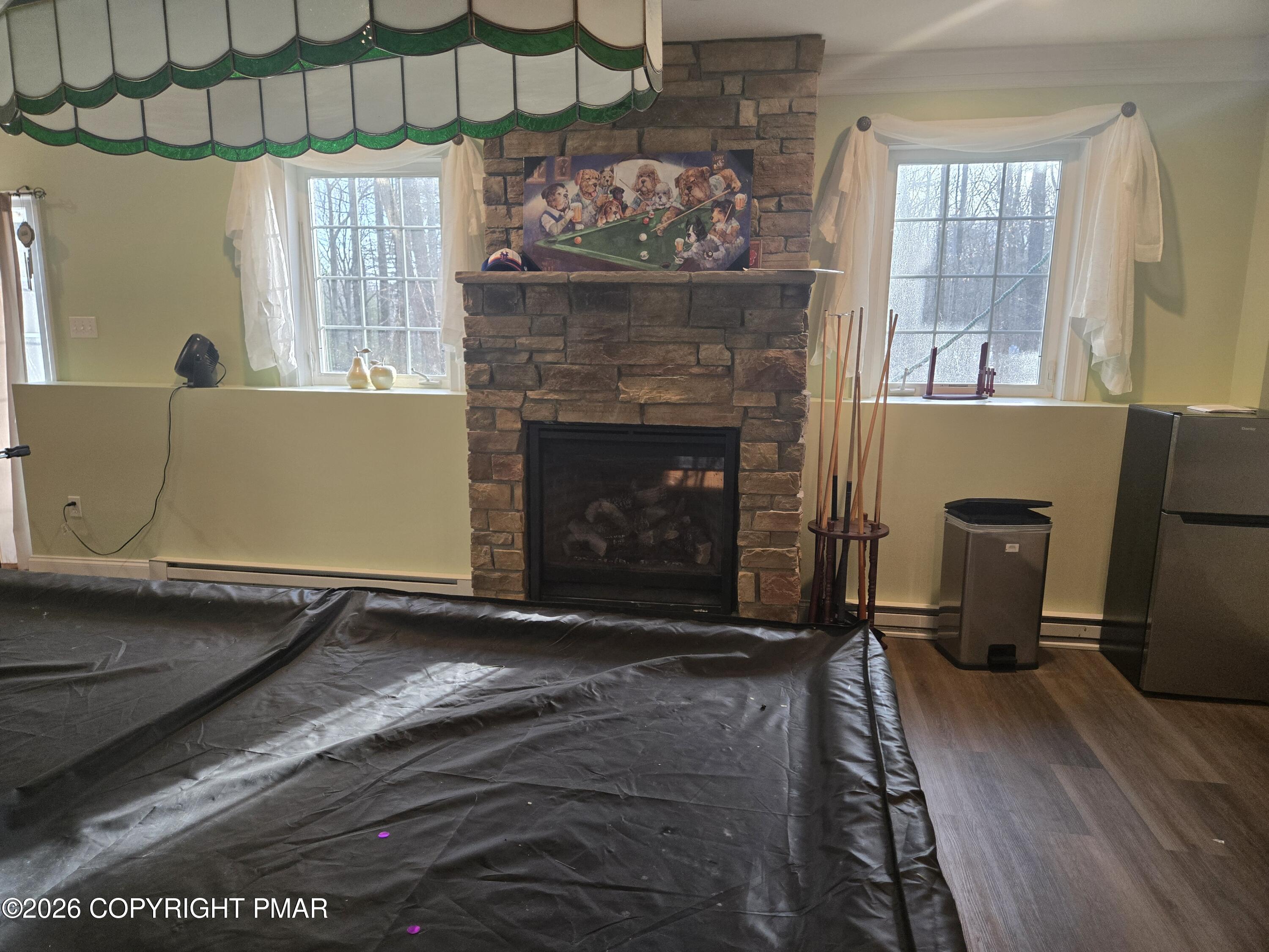 110 Crocus Lane Milford, PA 18337 - Photo 31 of 35 a living room with furniture and a fireplace