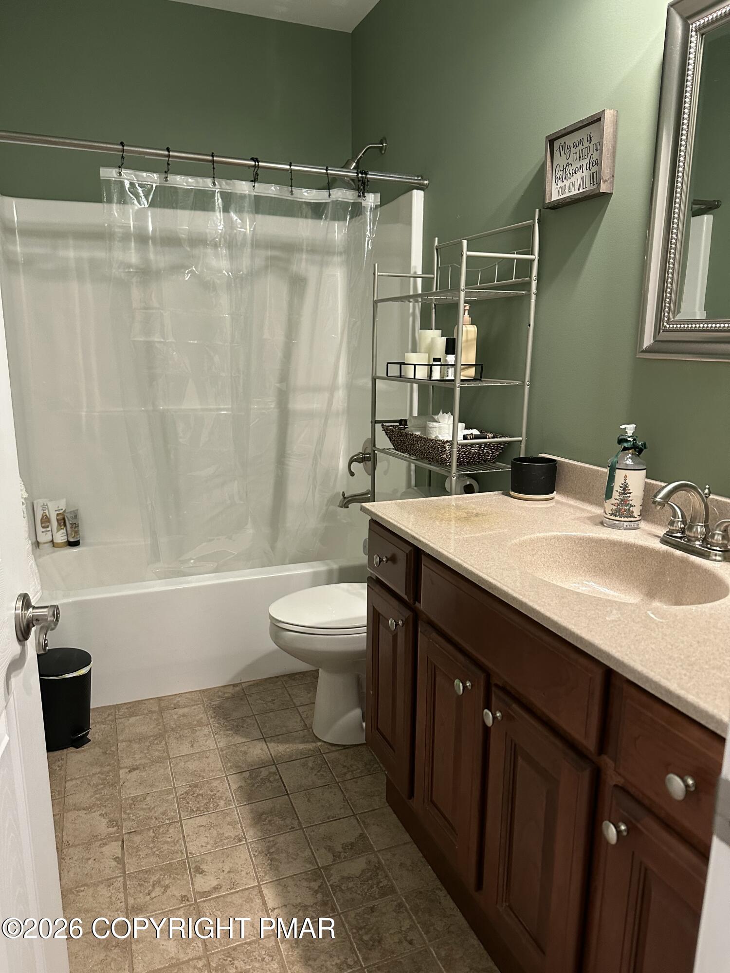 110 Crocus Lane Milford, PA 18337 - Photo 32 of 35 a bathroom with a double vanity sink toilet and shower