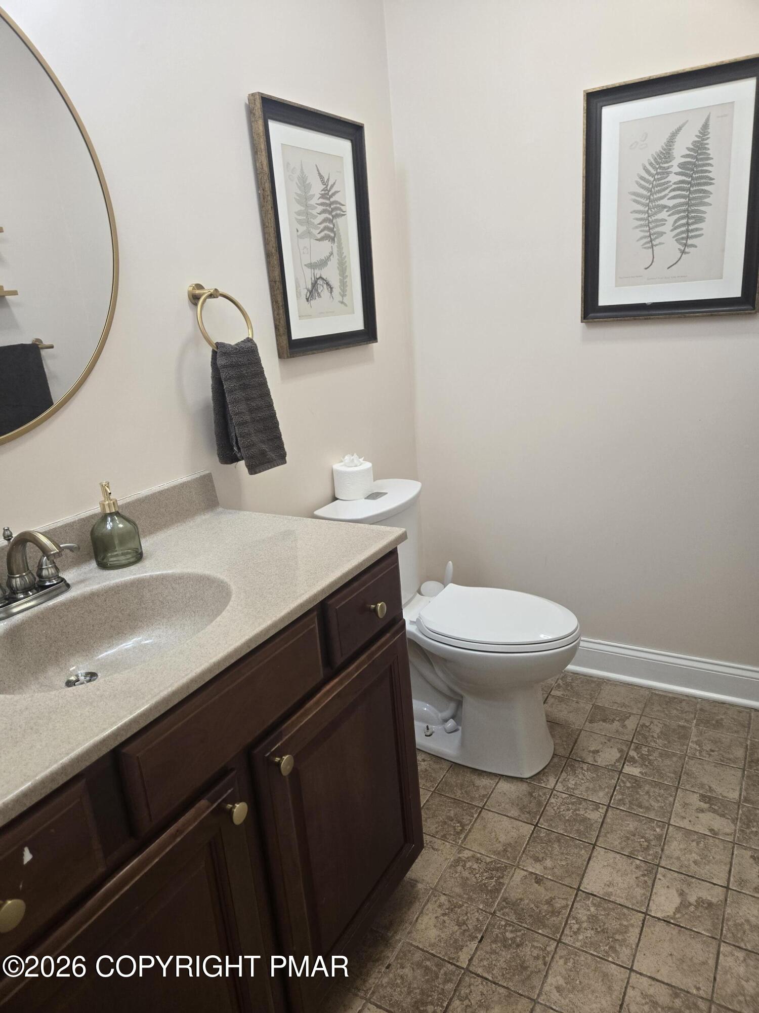 110 Crocus Lane Milford, PA 18337 - Photo 35 of 35 a bathroom with a toilet sink and mirror