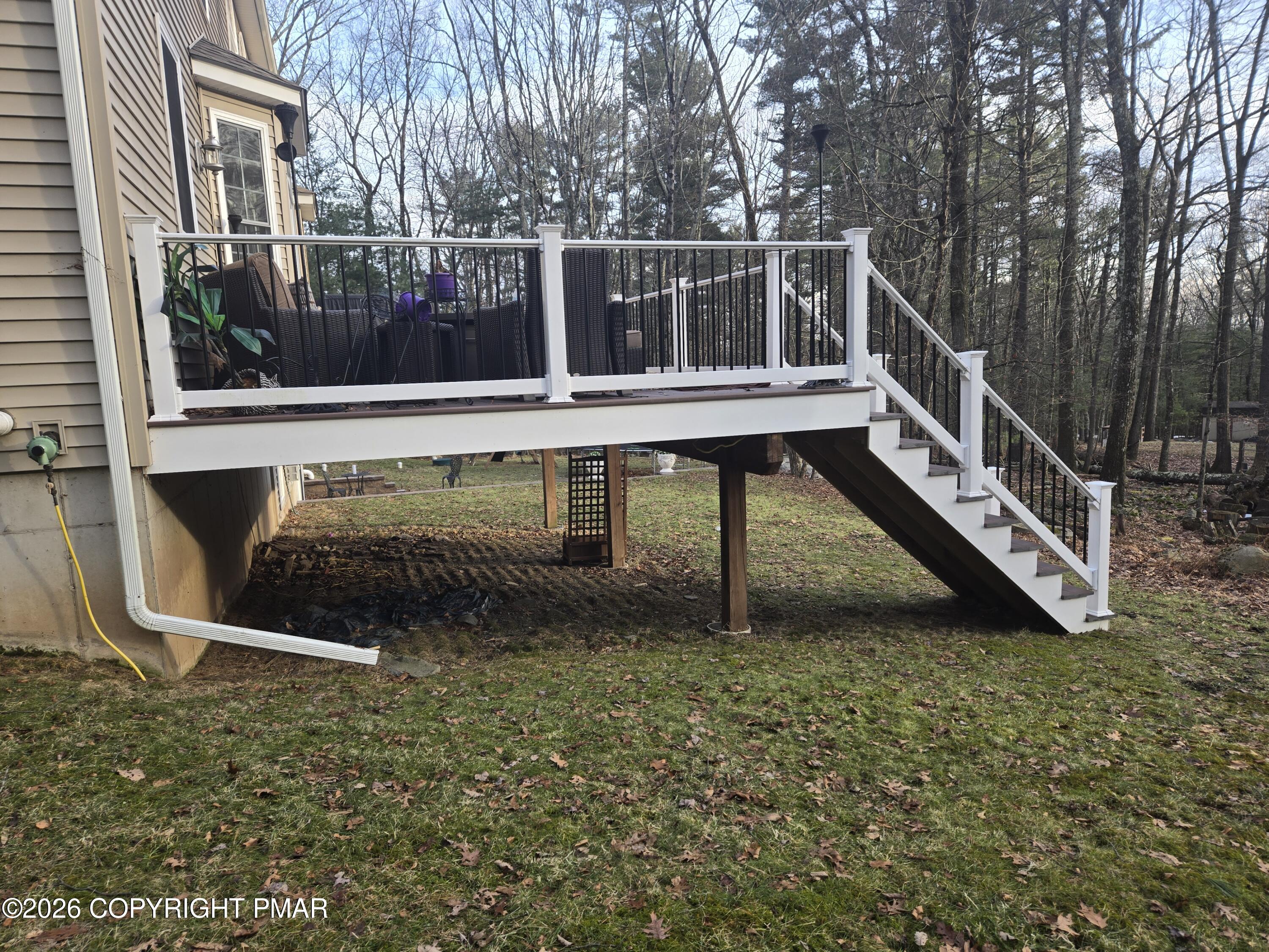 110 Crocus Lane Milford, PA 18337 - Photo 4 of 35 a view of wooden deck and a yard with swimming pool