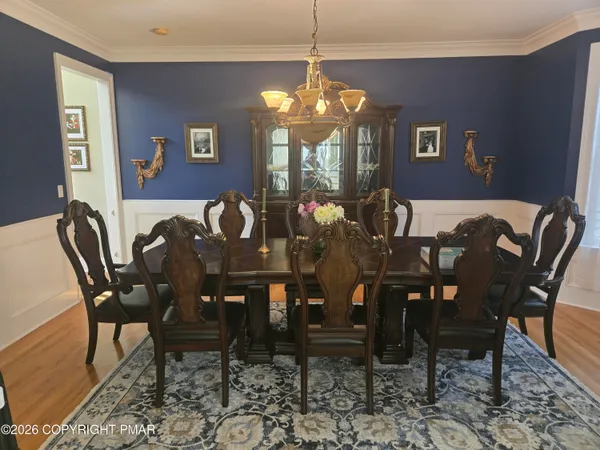 a view of a dining room with furniture and window