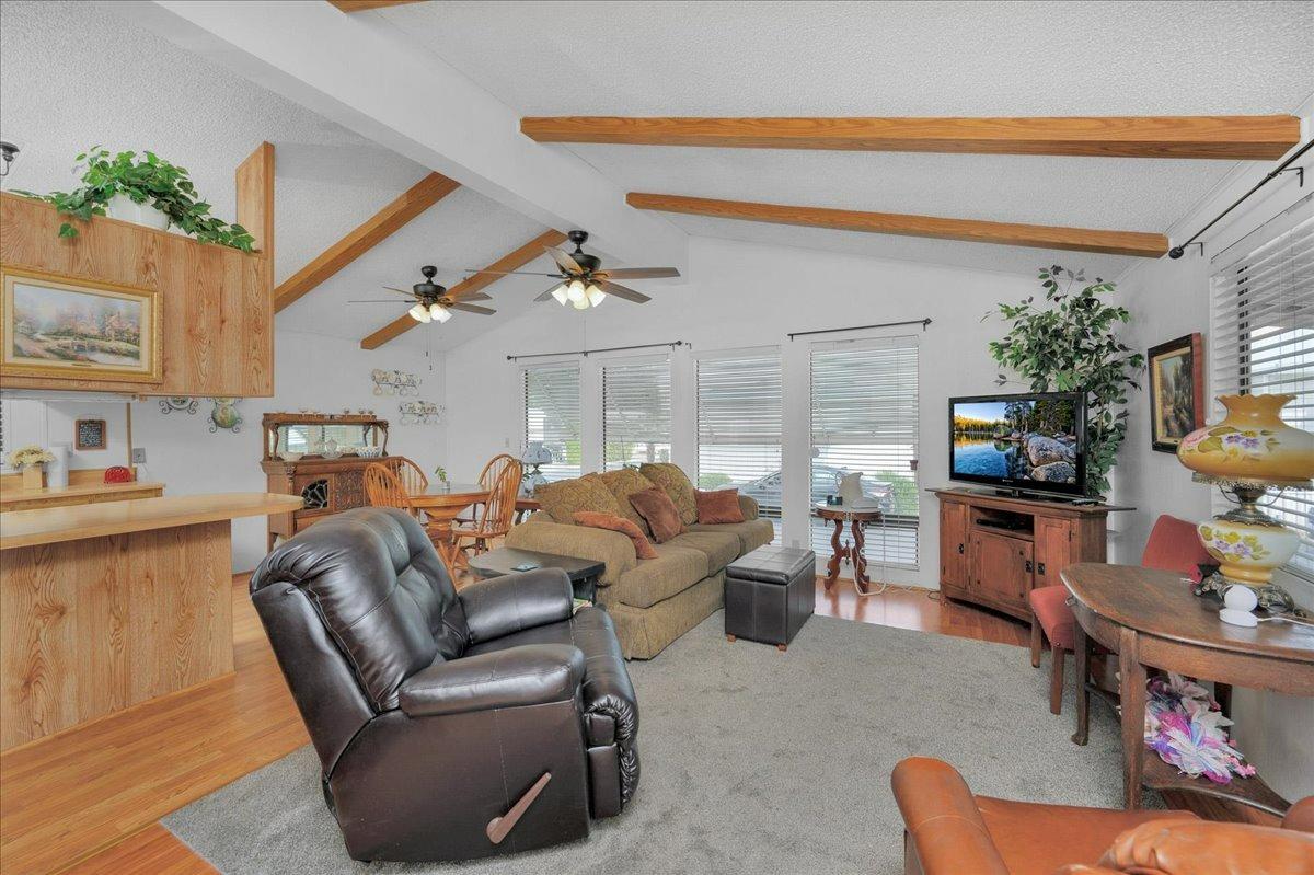 1001 Sylmar Avenue, Unit 199 Clovis, CA 93612 - Photo 11 of 50 a living room with furniture and a flat screen tv