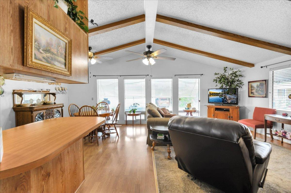 1001 Sylmar Avenue, Unit 199 Clovis, CA 93612 - Photo 13 of 50 a living room with fireplace furniture and a large window