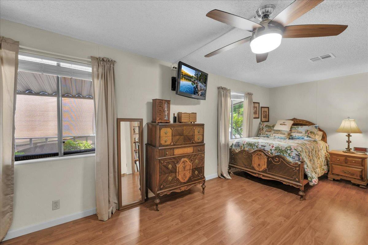 1001 Sylmar Avenue, Unit 199 Clovis, CA 93612 - Photo 18 of 50 a bedroom with a bed and a flat screen tv