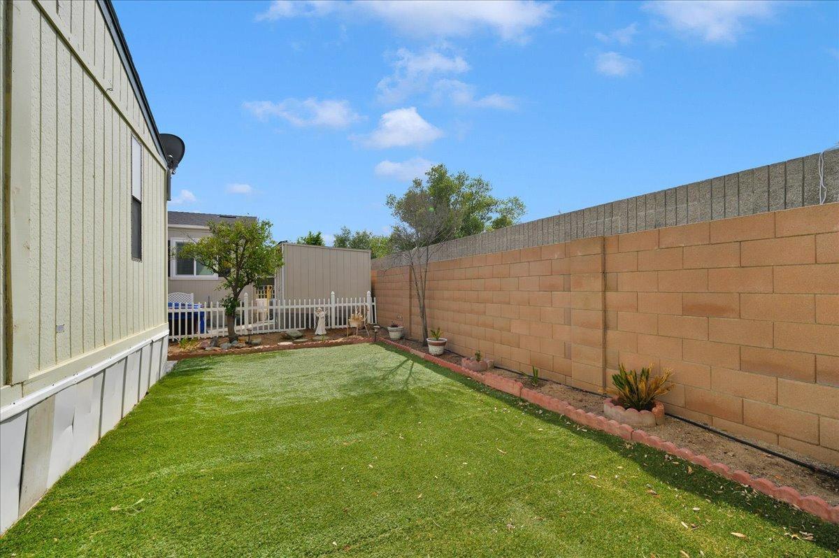 1001 Sylmar Avenue, Unit 199 Clovis, CA 93612 - Photo 28 of 50 a view of a backyard with sitting area