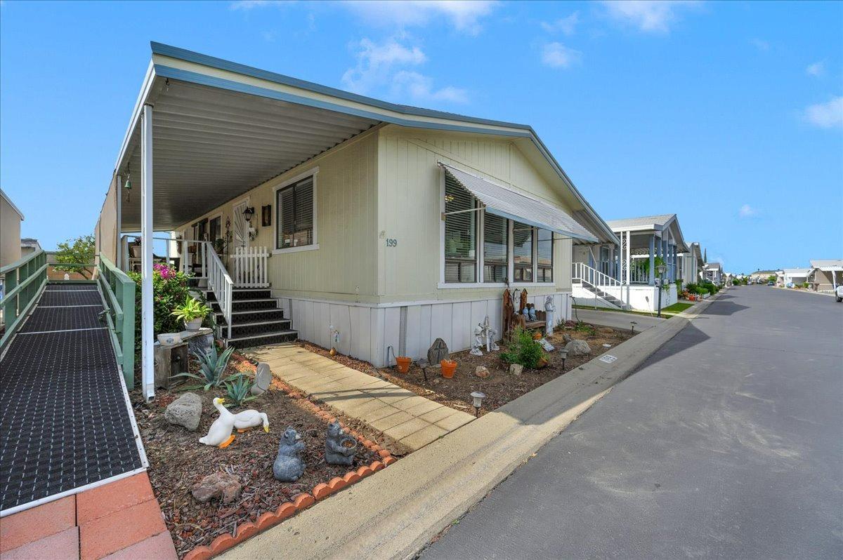 1001 Sylmar Avenue, Unit 199 Clovis, CA 93612 - Photo 33 of 50 a front view of house with yard