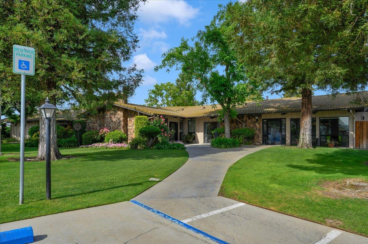 1001 Sylmar Avenue, Unit 199 Clovis, CA 93612 - Photo 44 of 50 front view of a brick house with a yard