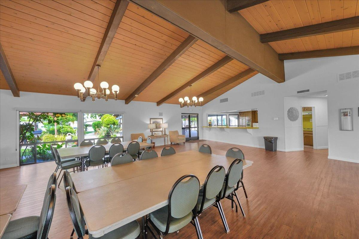 1001 Sylmar Avenue, Unit 199 Clovis, CA 93612 - Photo 47 of 50 a view of a dining room with furniture a chandelier and wooden floor
