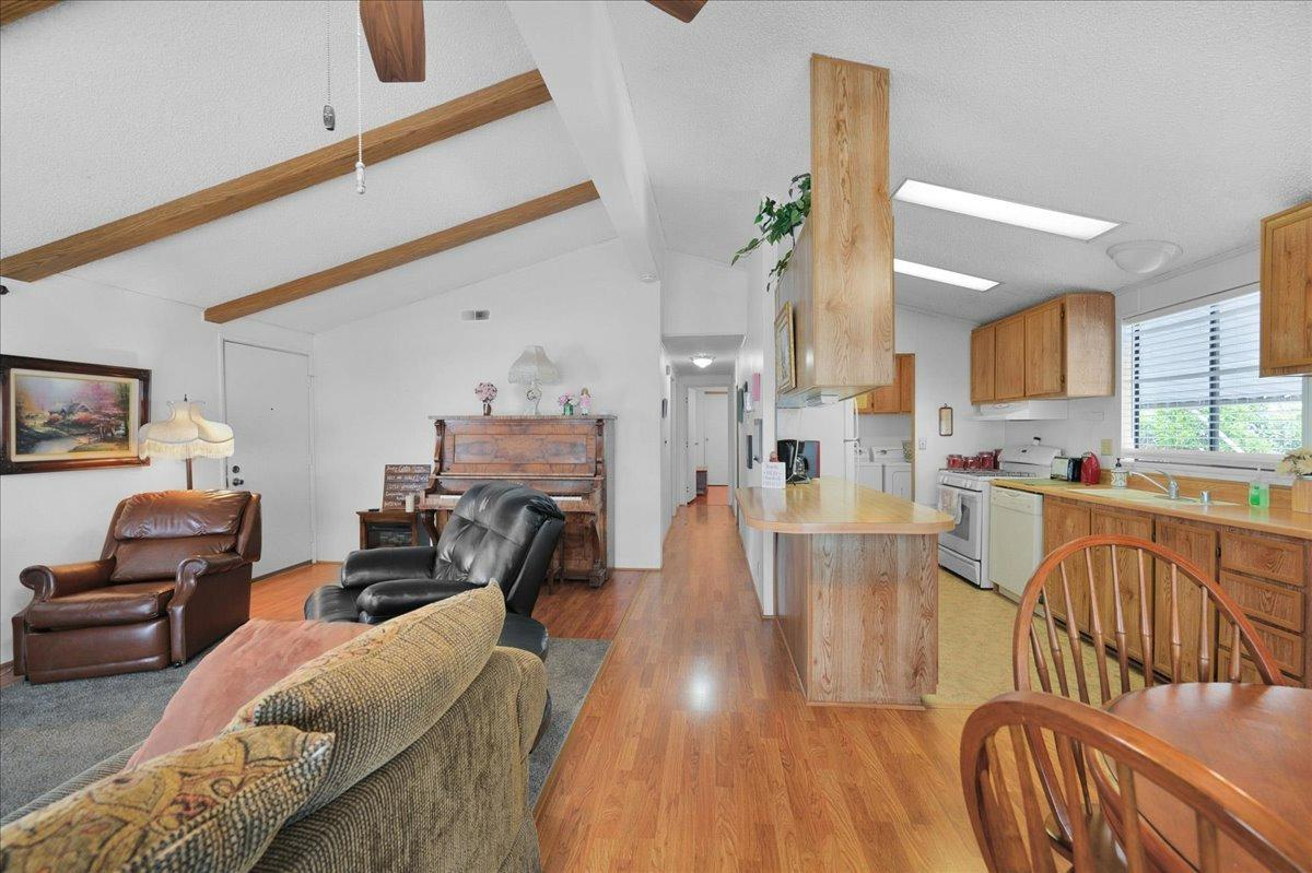 1001 Sylmar Avenue, Unit 199 Clovis, CA 93612 - Photo 10 of 50 a living room with furniture and a wooden floor