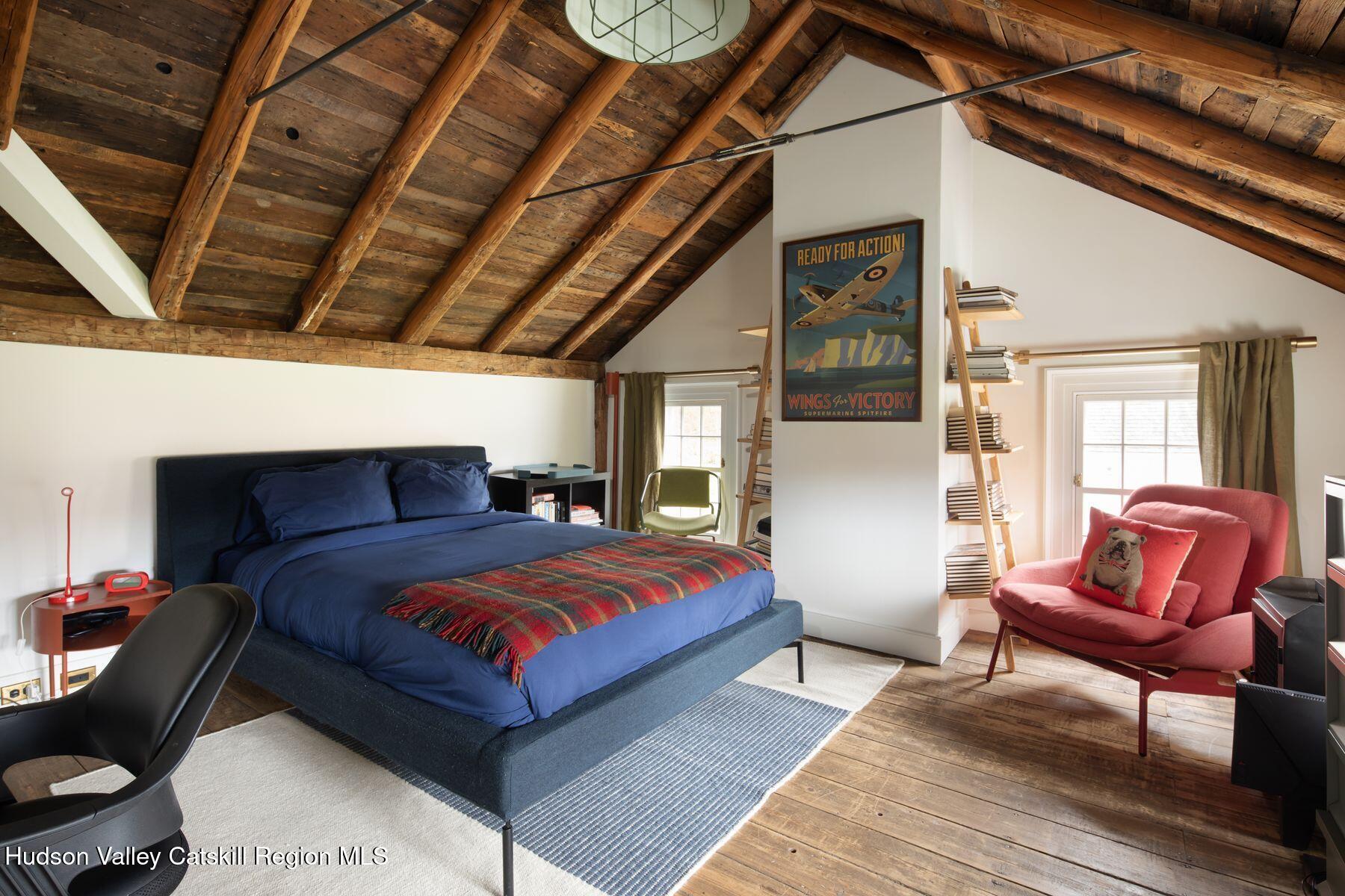 2073 Highway 82 Ancram, NY 12502 - Photo 16 of 22 a bed room with a bed and a chair