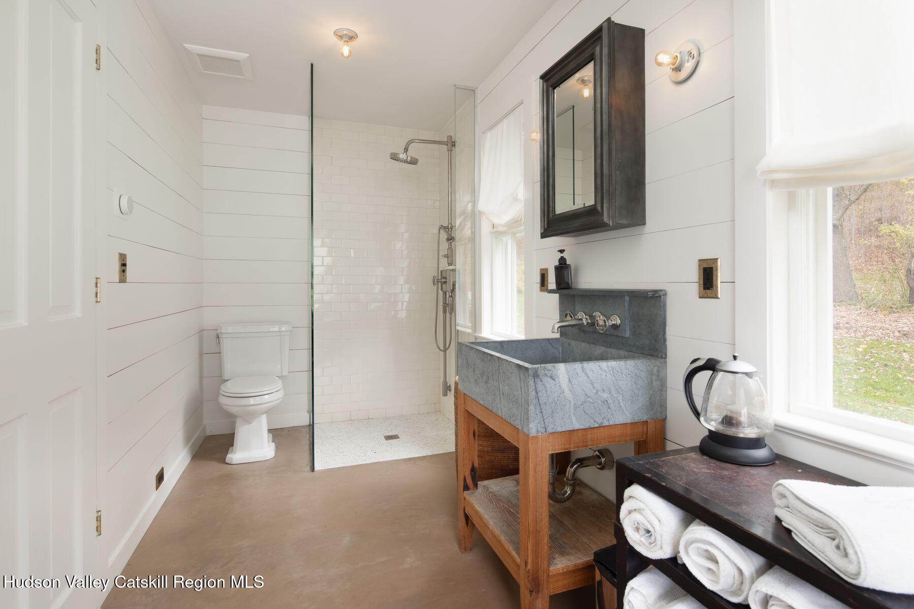 2073 Highway 82 Ancram, NY 12502 - Photo 22 of 22 a living room with furniture and a fireplace