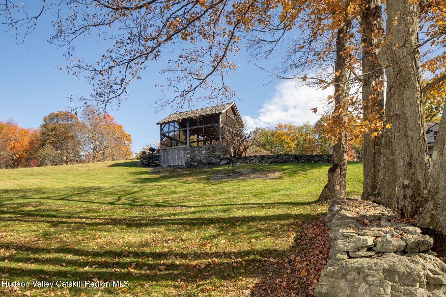 2073 Highway 82 Ancram, NY 12502 - Photo 5 of 22 a view of a swimming pool with an outdoor space and seating area