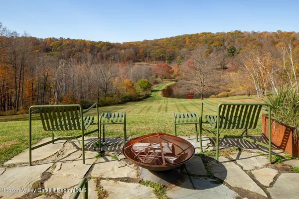 a view of a chairs and a table in the patio